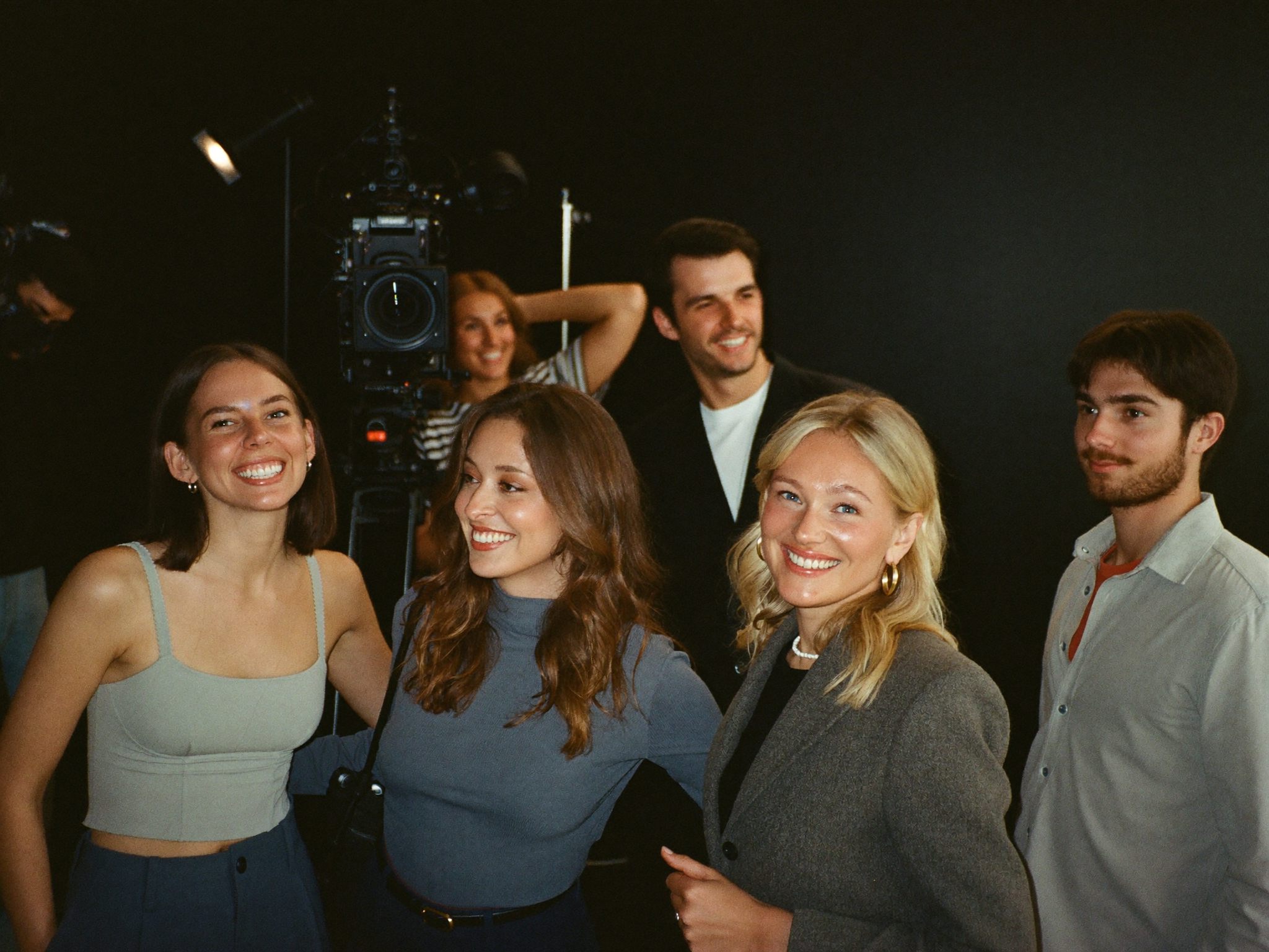The team together in the studio between takes, camera rig behind them